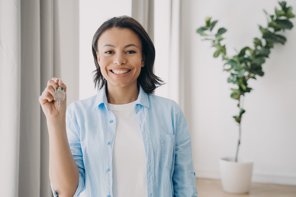 A woman holding house keys