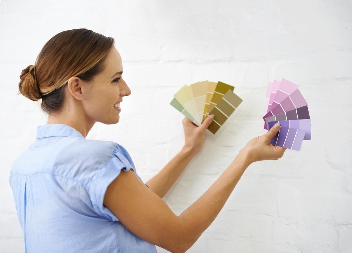 A woman looking at paint colors