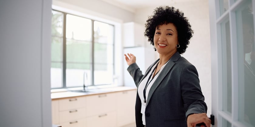 Woman Showing Modern Kitchen in New Home