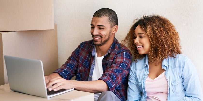 Happy Young Couple Moving Into New Home