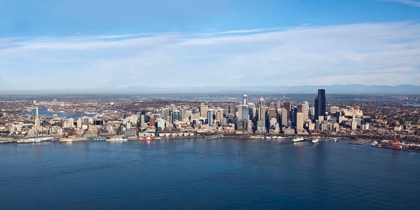 This image features the Seattle skyline, representing property management in Everett, Washington