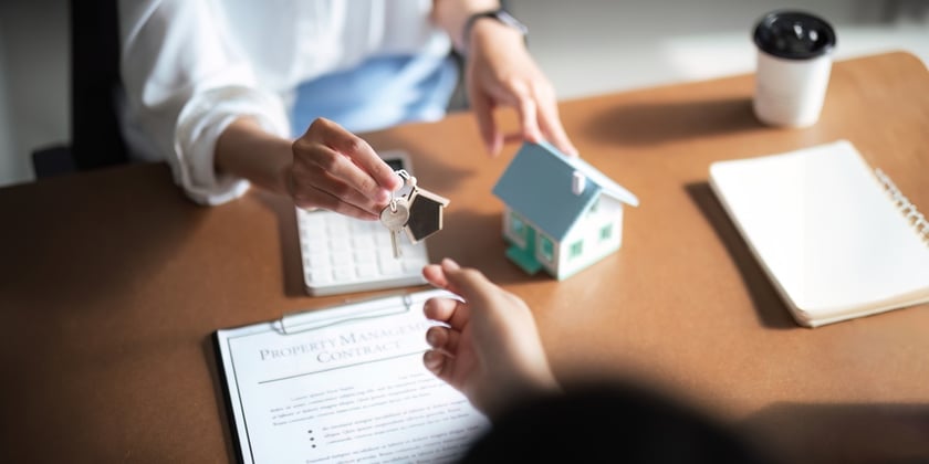 Real Estate Agent Giving House Keys for New Home