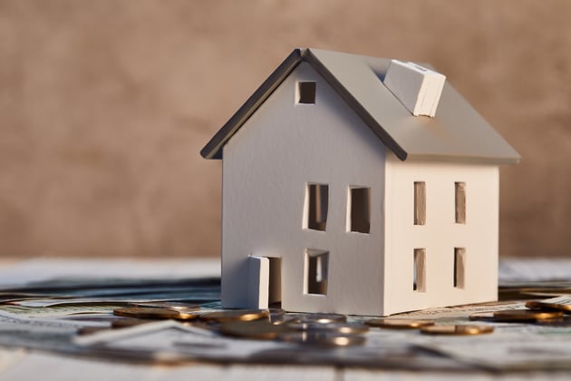 Model house with coins