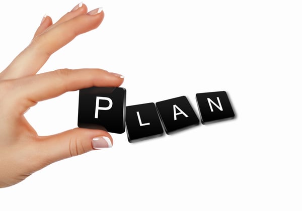 The word plan spelled out in tiles
