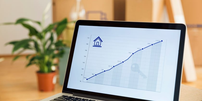 Rising line graph on laptop screen