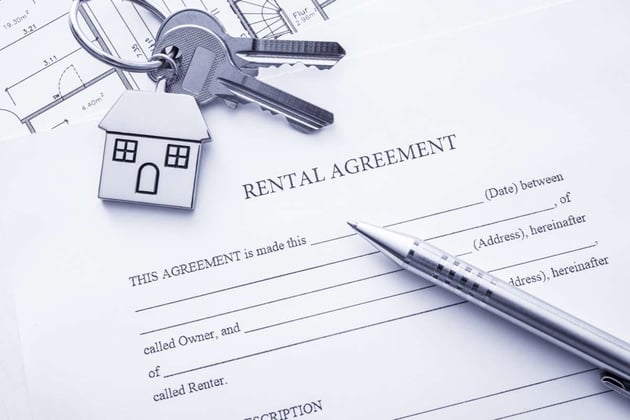 A rental agreement with house keys helps property owners process rental applications
