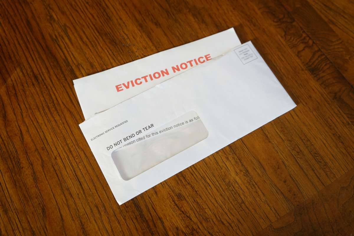 Close-up Of An Eviction Notice In Envelope on Desk
