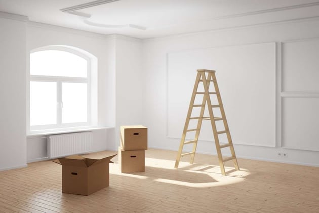 Empty room with boxes and ladder, how long can a rental property be vacant concept