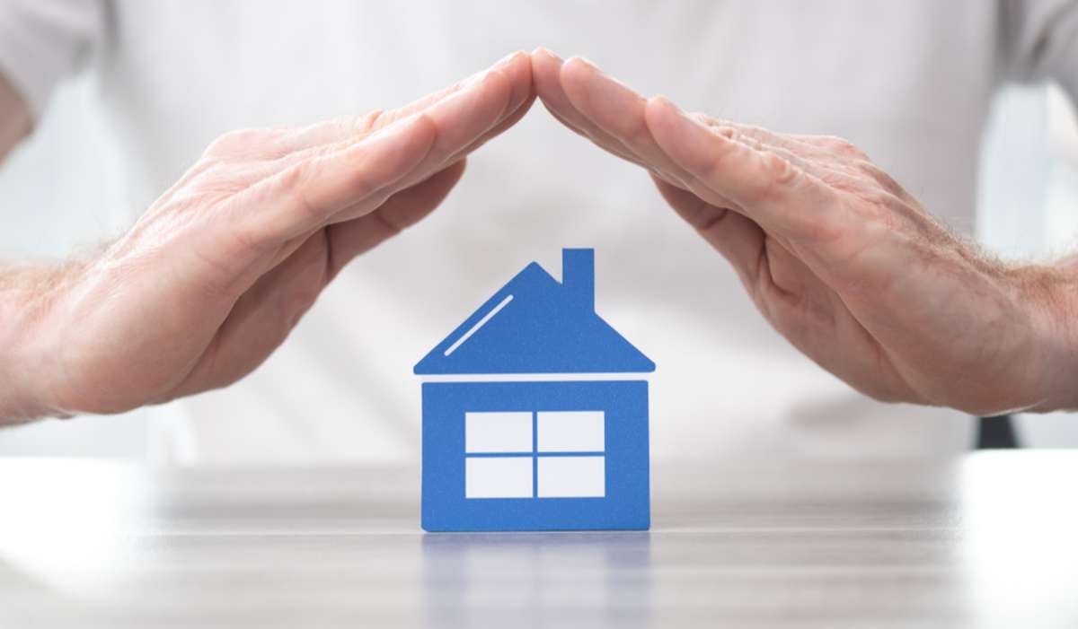 Hands over a small home, Seattle property management concept