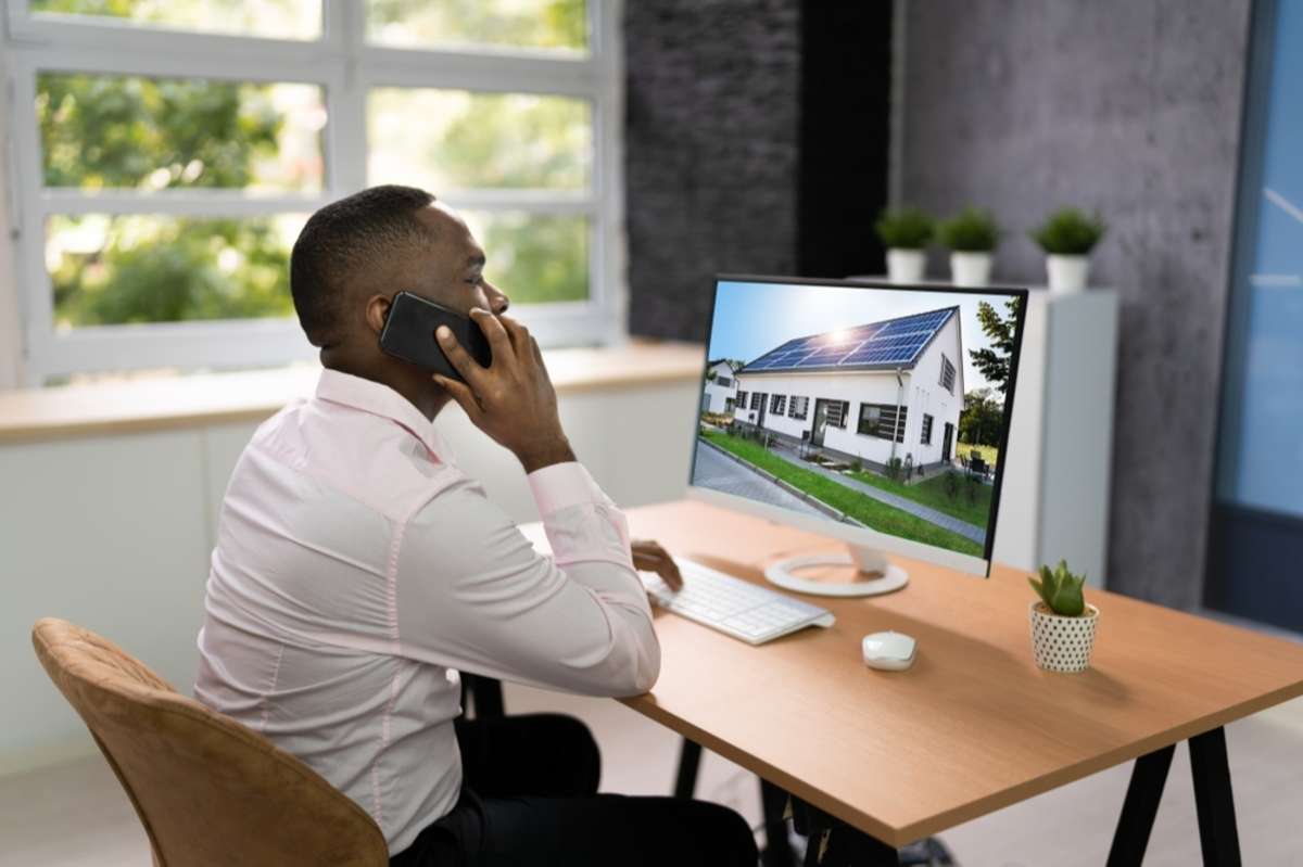 Man looking at house listing on a computer screen, how to find a new tenant concept