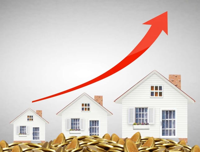 Mortgage concept by money house from coins