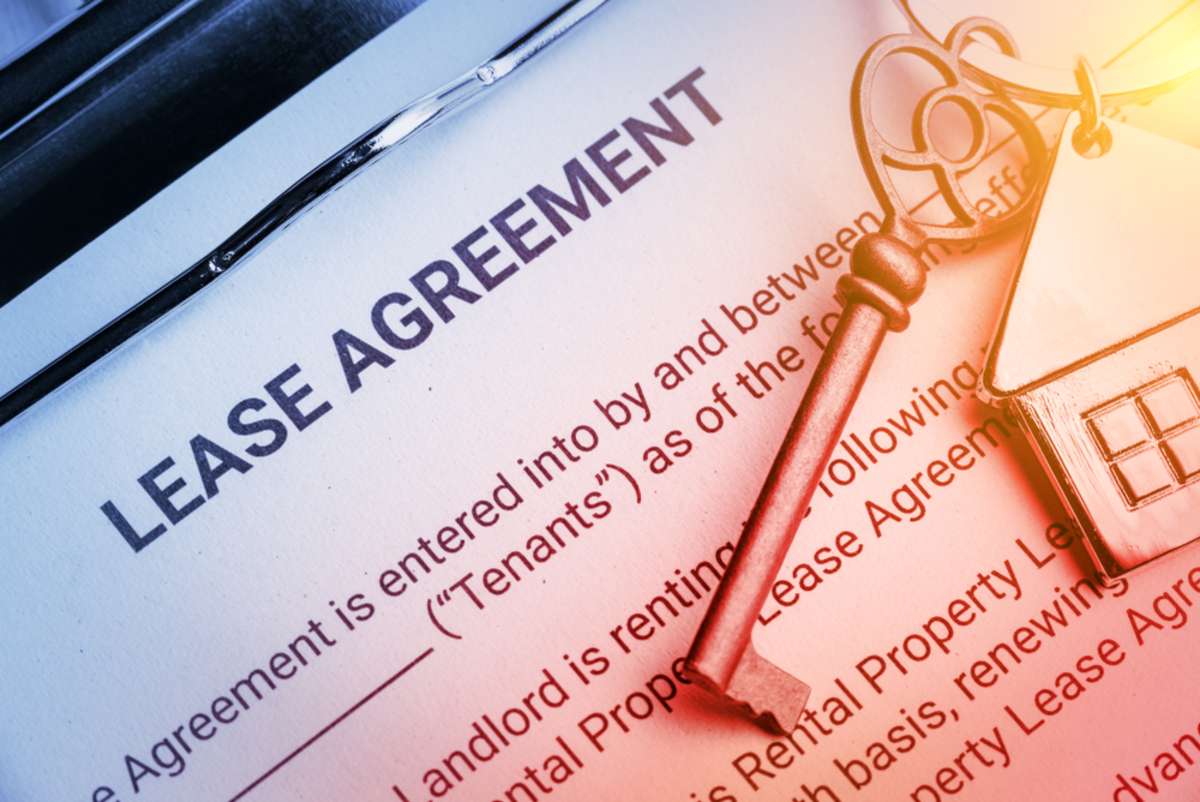 Pen and keychain on a lease agreement form