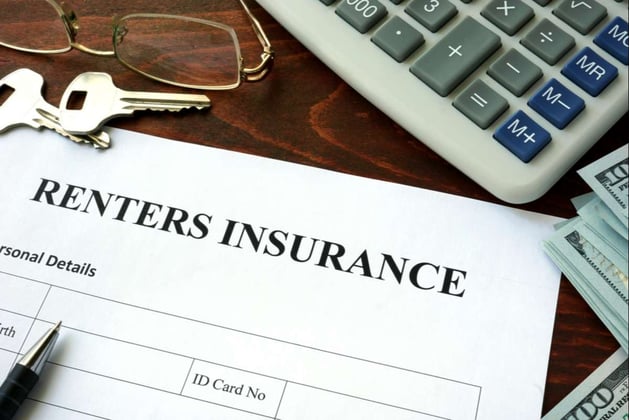 Renters insurance form on a table; Should landlords require renters insurance in Seattle