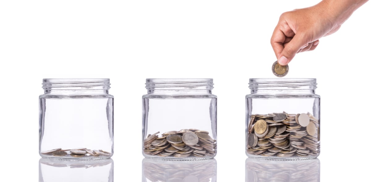 Thai coin in clear glass jar with different level from less to more (S) (R)