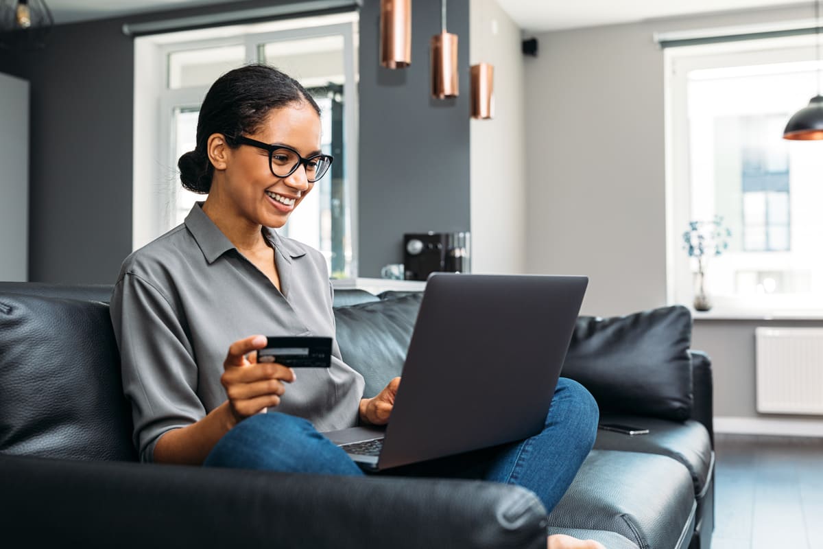 A woman paying rent online from her laptop
