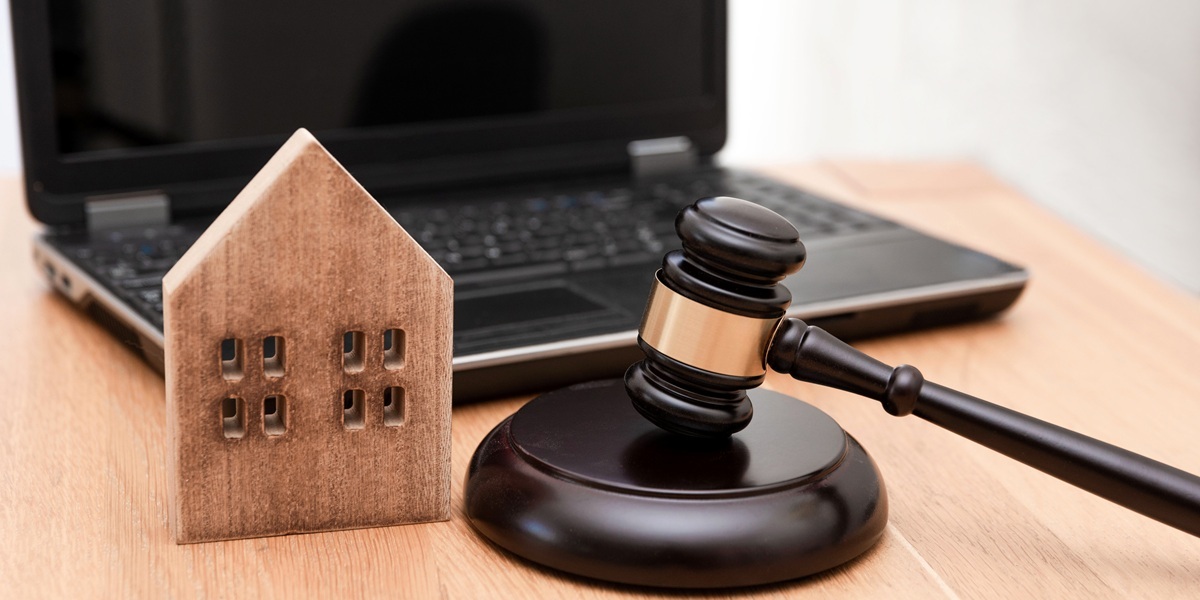  A wooden house next to a judge gavel