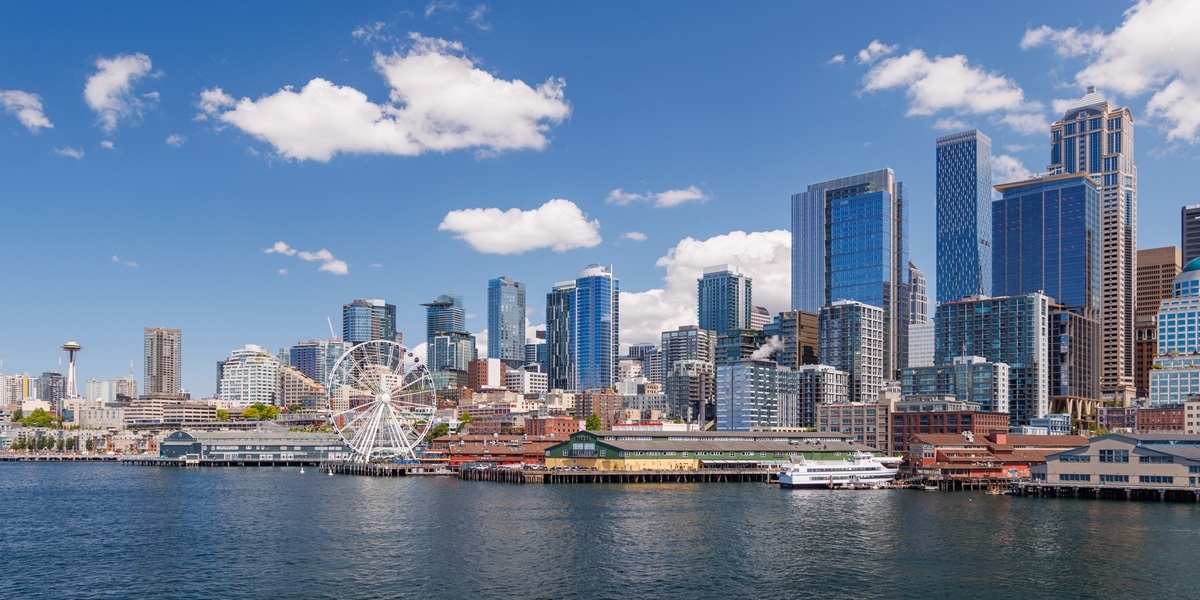 Bright and sunny panoramic view of Seattle skyline from the water