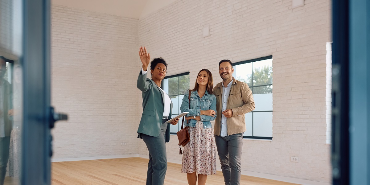 Real estate agent showing property