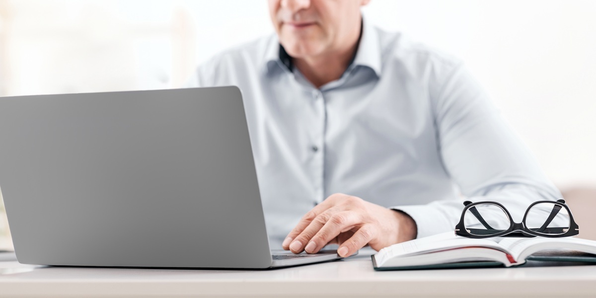 landlord on a laptop doing research about leasing