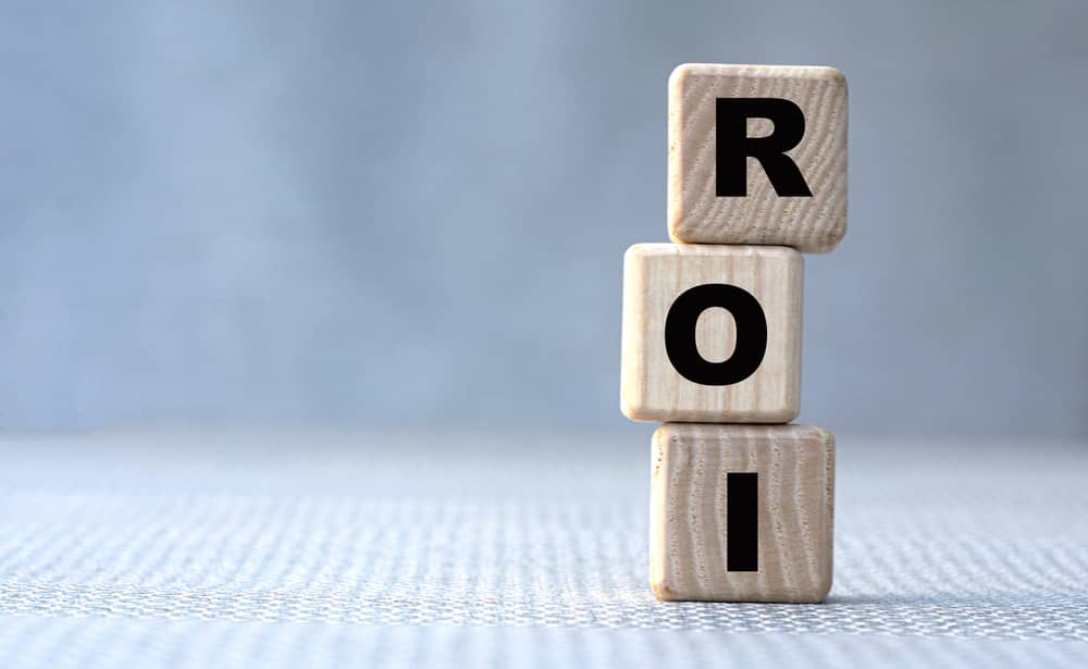 concept word ROI (Return on Investment) on wooden cubes