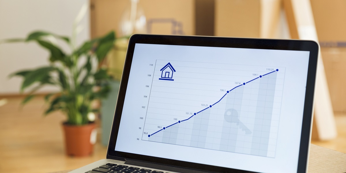 Rising line graph on laptop screen