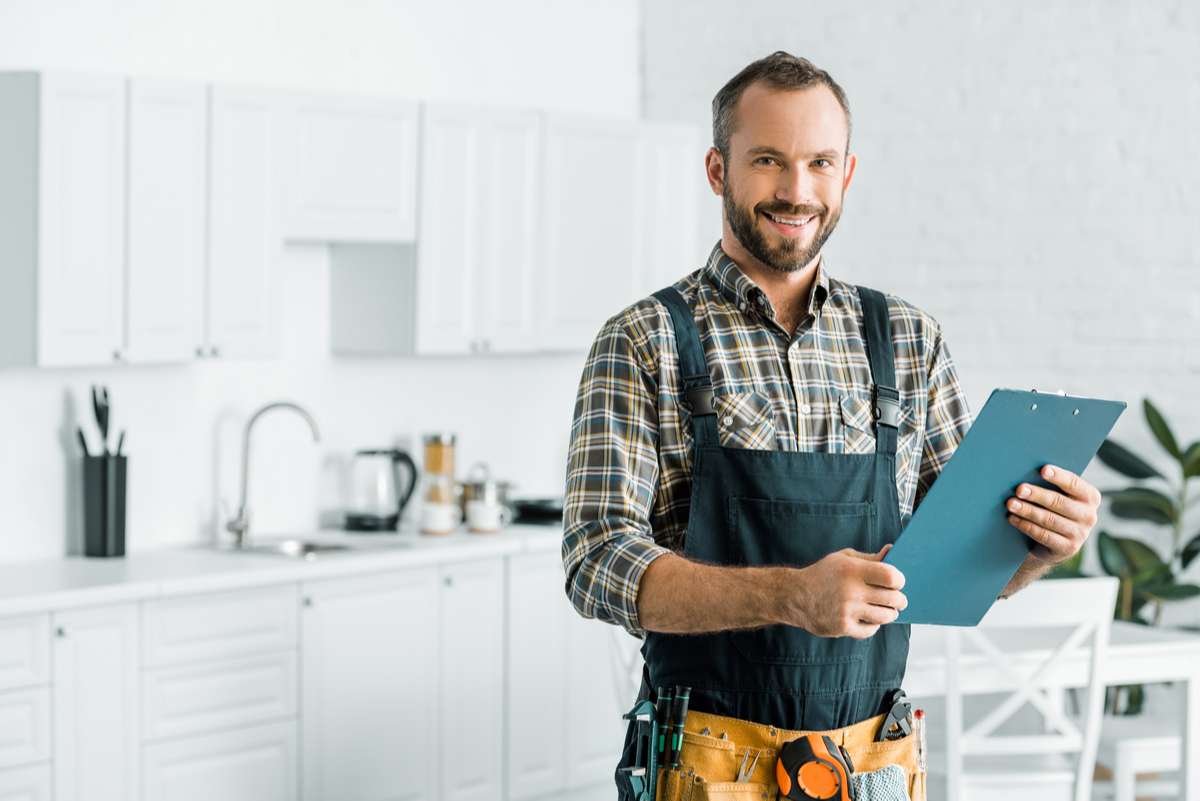 A handyman smiling