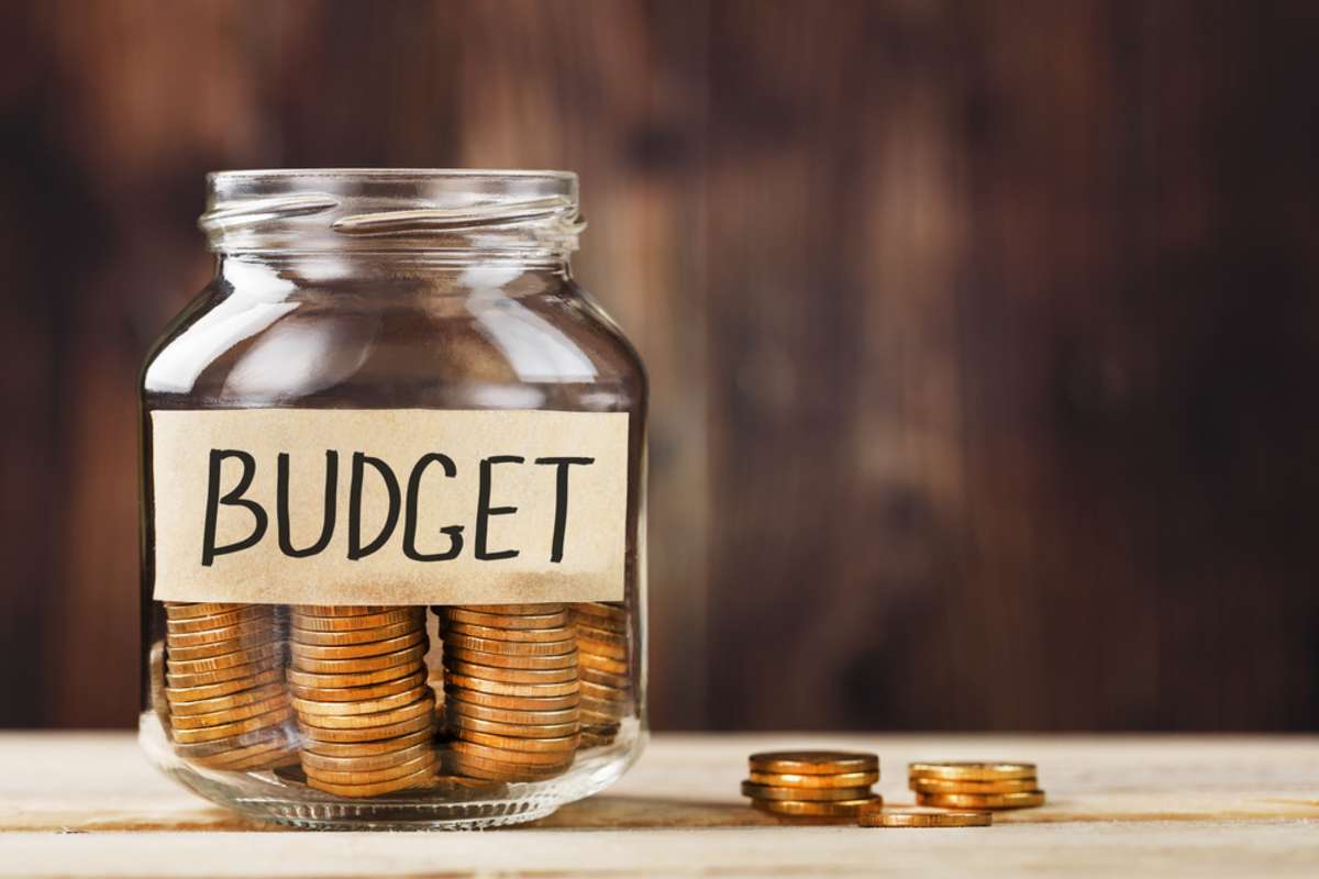 Glass jar with money in it represents a rental property maintenance budget